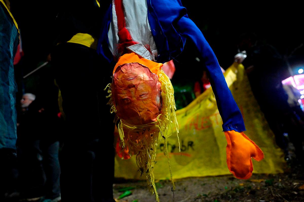 A person holds a dummy depicting US President Donald Trump during a protest in defense of national sovereignty after trade tariffs and sanctions were imposed by the US government on Brazil, near the US consulate in Rio de Janeiro, Brazil - AFPPix