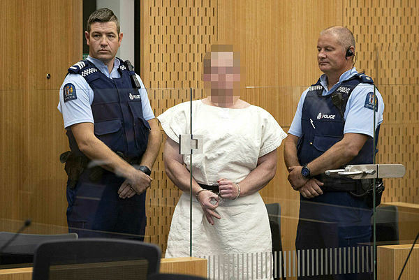 In this file photo taken on March 16, 2019 Brenton Tarrant, the man charged in relation to the Christchurch massacre, makes a sign to the camera during his appearance in the Christchurch District Court. — AFP
