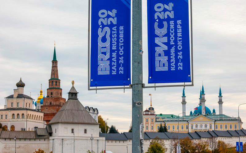 A view shows a banner with the logo of the annual BRICS summit next to the Kazan Kremlin in Kazan, Russia October 22, 2024. - REUTERS/Maxim Shemetov