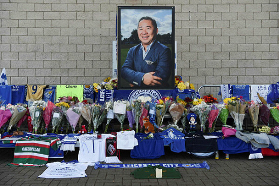A portrait of Leicester City Football Club’s Thai chairman Vichai Srivaddhanaprabha, who died in a helicopter crash at the club’s stadium, is seen amid flowers and tributes outside the King Power Stadium in Leicester, eastern England, on Oct 29, 2018. — AFP