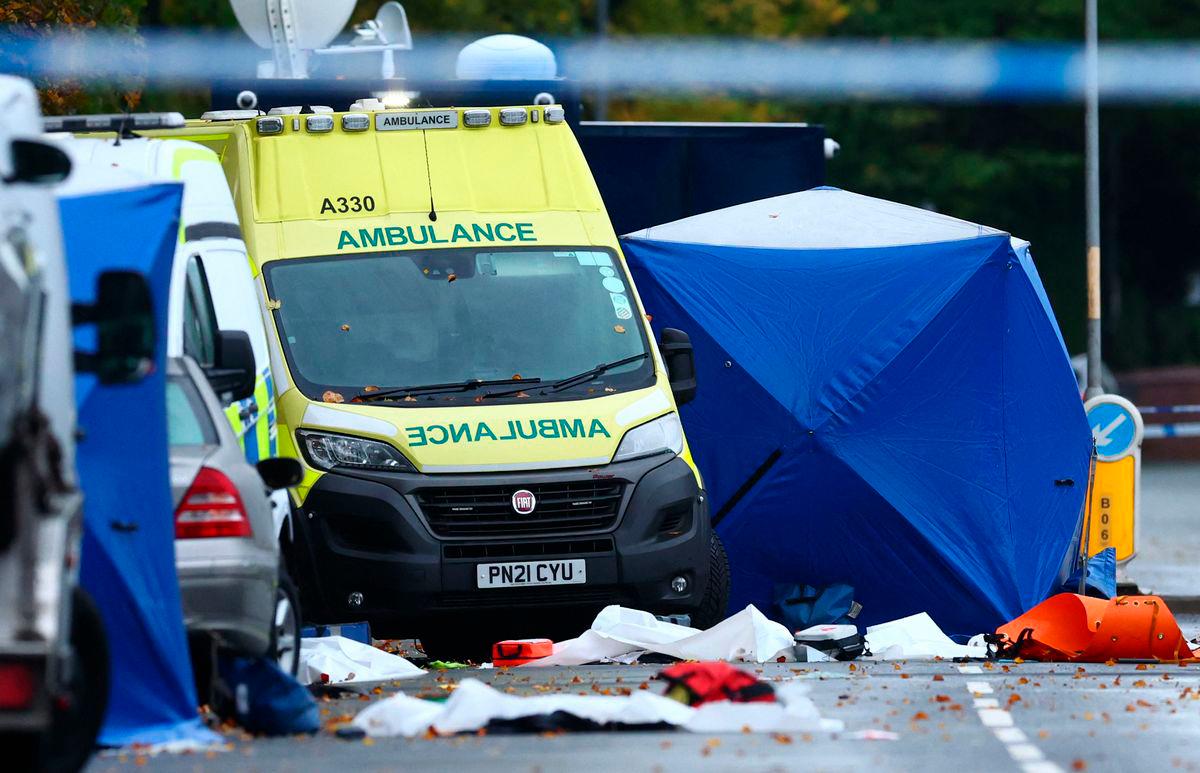 Police tents cover parts of the scene on the main road outside Heaton Park Hebrew Congregation synagogue in Crumpsall, north Manchester, on October 3, 2025, following an attack at the synagogue yesterday. An attacker ploughed a car into a crowd outside a packed synagogue in Britain on Thursday, a Jewish holiday, before going on a stabbing spree, killing two people and leaving three wounded, police said. (Photo by Paul Currie / AFP)
