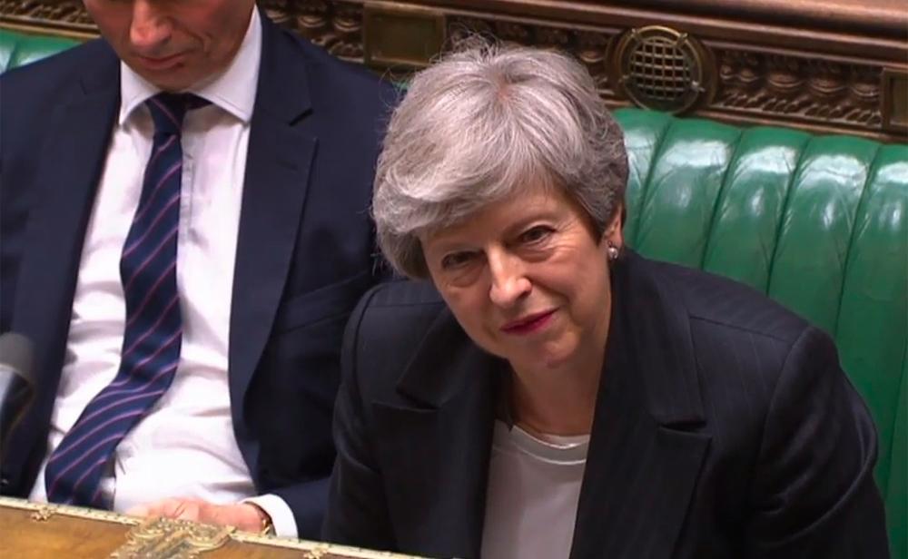 A video grab from footage broadcast by the UK Parliament's Parliamentary Recording Unit (PRU) shows Britain's Prime Minister Theresa May listening to a question during the weekly Prime Minister's Questions (PMQs) session in the House of Commons in London on May 22, 2019. - AFP