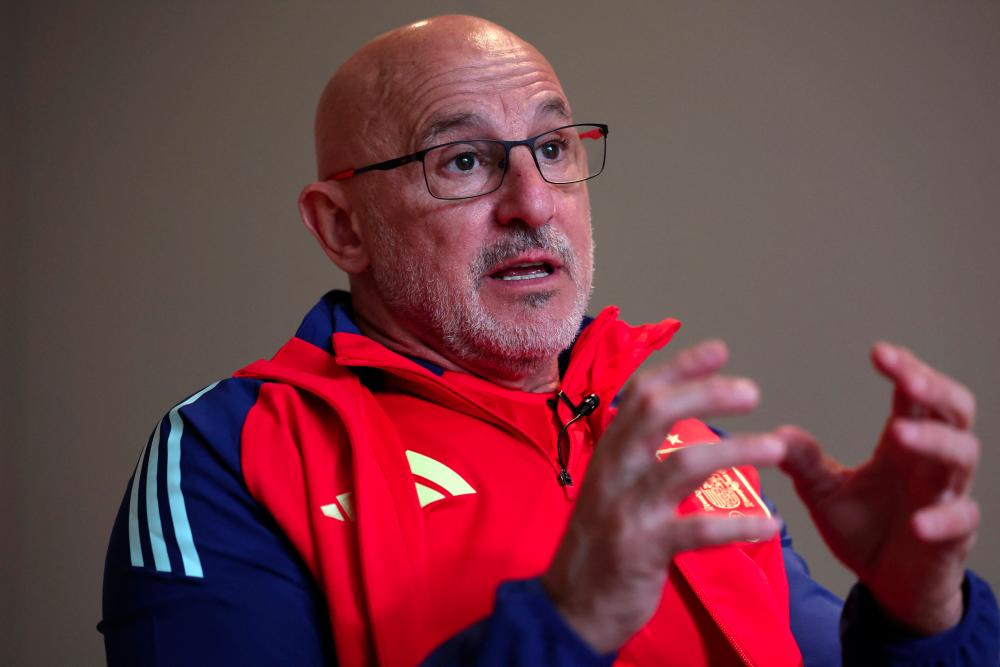 Spain's coach Luis de la Fuente gestures while giving an interview to AFP in east London on March 22, 2024, ahead of Spain's friendly international football match against Colombia in London later in the day. - AFPPIX