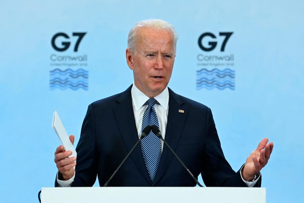 US President Joe Biden takes part in a press conference on the final day of the G7 summit at Cornwall Airport Newquay, near Newquay, Cornwall on June 13, 2021. – AFP