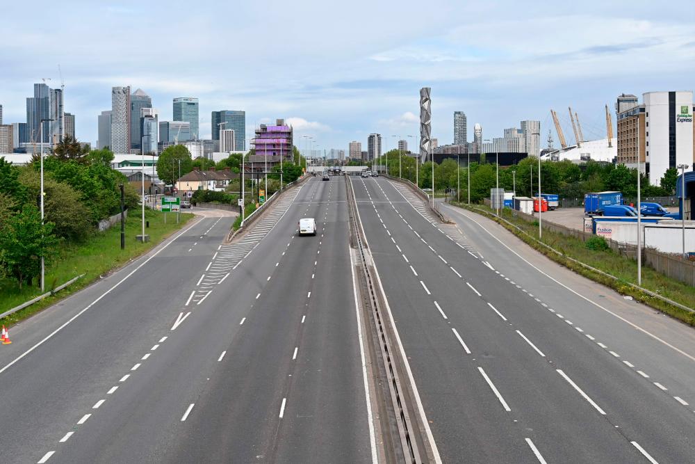 The near deserted A102, Blackwall Tunnel approach road is pictured on Sunday morning in Greenwich, in London on May 3, 2020, during the nationwide lockdown due to the novel coronavirus COVID-19 pandemic. — AFP