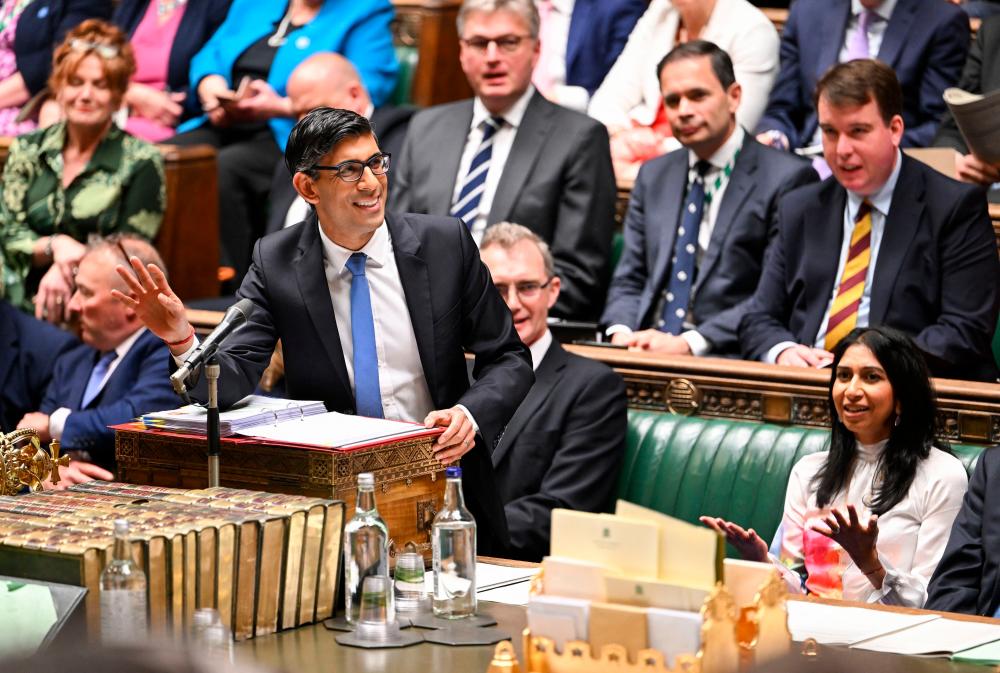 A handout photograph released by the UK Parliament shows Britain’s Prime Minister Rishi Sunak (L) and Britain’s Home Secretary Suella Braverman during the weekly session of Prime Minister’s Questions (PMQs) at the House of Commons, in London, on May 24, 2023. AFPPIX