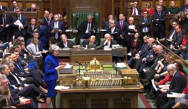 A video grab from footage broadcast by the UK Parliament’s Parliamentary Recording Unit (PRU) shows Britain’s Prime Minister Theresa May as she stands and speaks during the weekly Prime Minister’s Questions (PMQs) in the House of Commons in London on Jan 16, 2019. — AFP