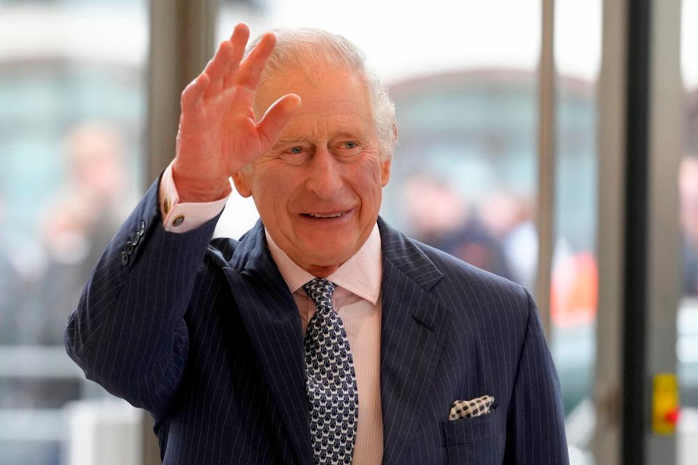 Britain’s King Charles III waves as he arrives for a visit to the new European Bank for Reconstruction and Development (EBRD) in London on March 23, 2023/AFPPix