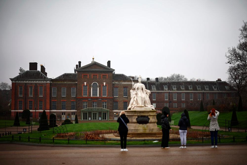 People take pictures of Kensington Palace in London on March 11, 2024. Britain’s Prince William and his wife Catherine faced pressure to explain how an official photo of the princess and their children had been altered, after AFP and other news agencies withdrew the image/AFPPix