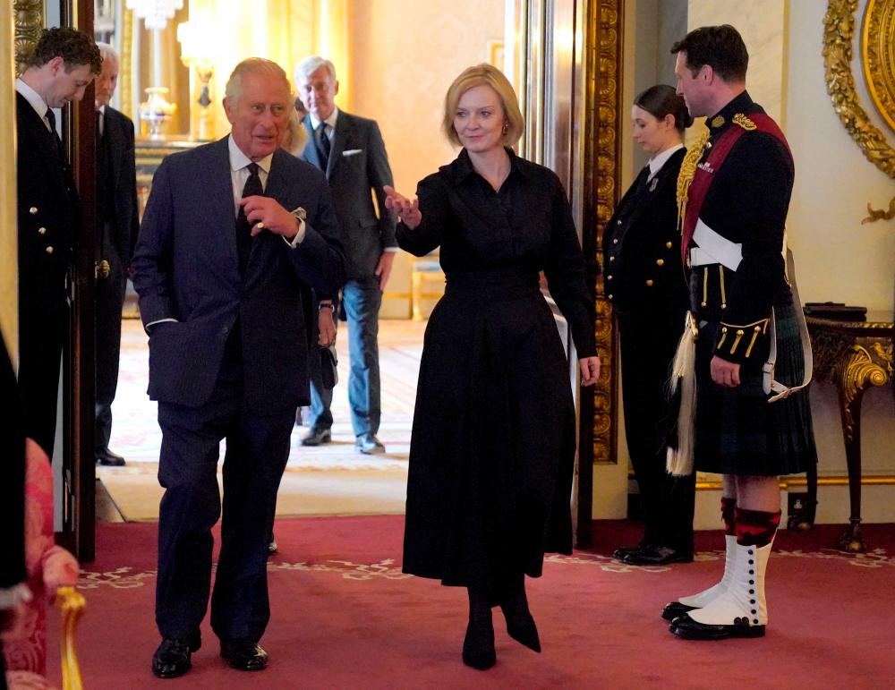 King Charles III (2nd L) has an audience with Prime Minister Liz Truss (C) and members of her Cabinet in the 1844 Room, at Buckingham Palace in London on September 10, 2022. AFPPIX