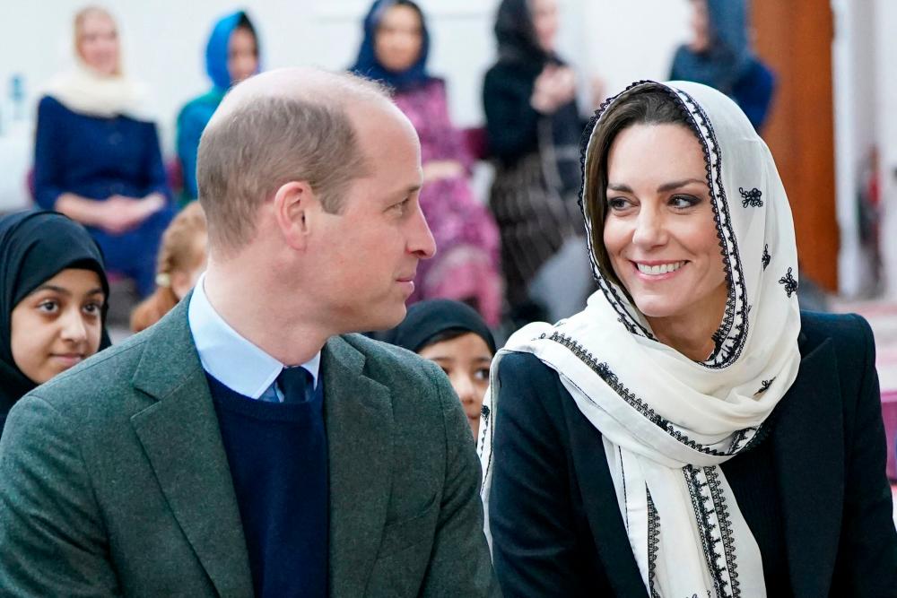 Britain’s Prince William, Prince of Wales (L) and Britain’s Catherine, Princess of Wales react during a visit to the Hayes Muslim Centre, in Hayes, Greater London, March 9, 2023 to thank those involved in the aid effort and fundraising to help communities affected by the earthquakes in Turkey and Syria/AFPPix