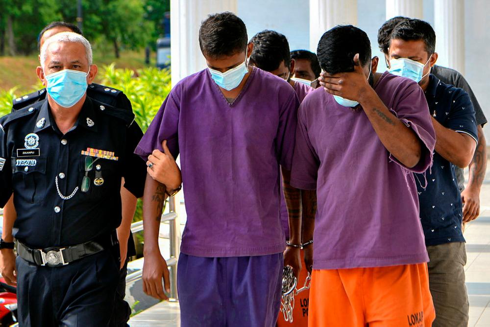 T. Thurairaj and T. Gunarajwo who are brothers were charged today for the murder of their friend.-Bernama