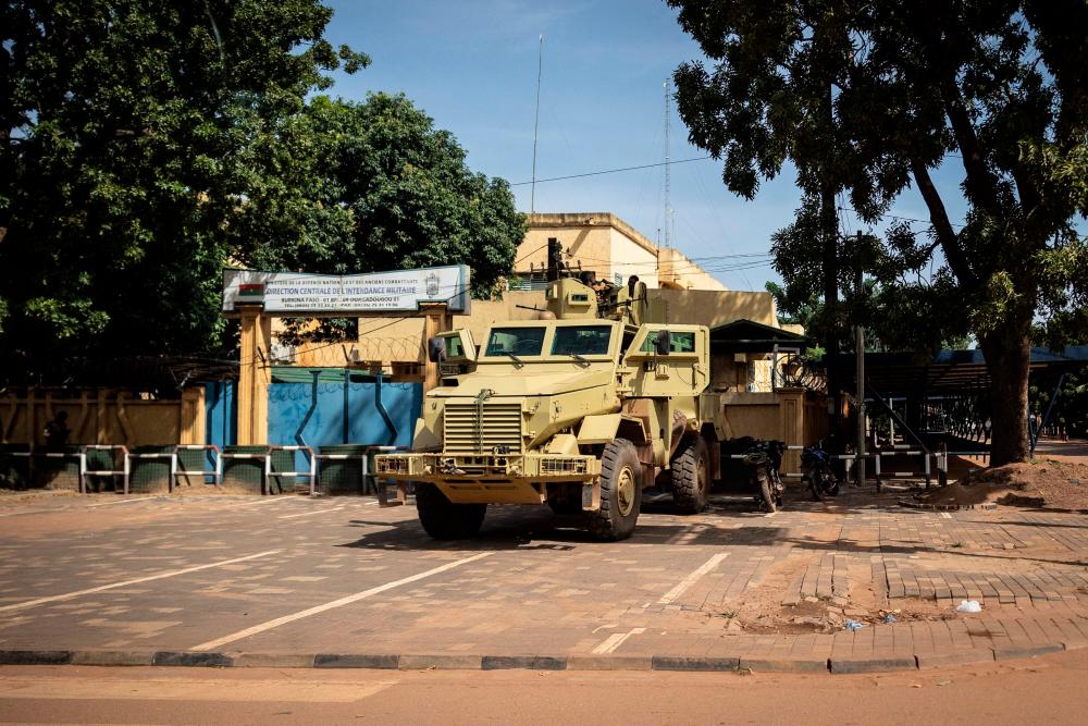 A military vehicle is seen in front of Burkina faso national television, In Ouagadougou on October 1, 2022. Burkina Faso awoke to fresh uncertainty Saturday after its second coup this year when junior officers toppled a junta leader, saying he had failed to fight jihadist attacks in the deeply poor and restive West African nation. AFPPIX