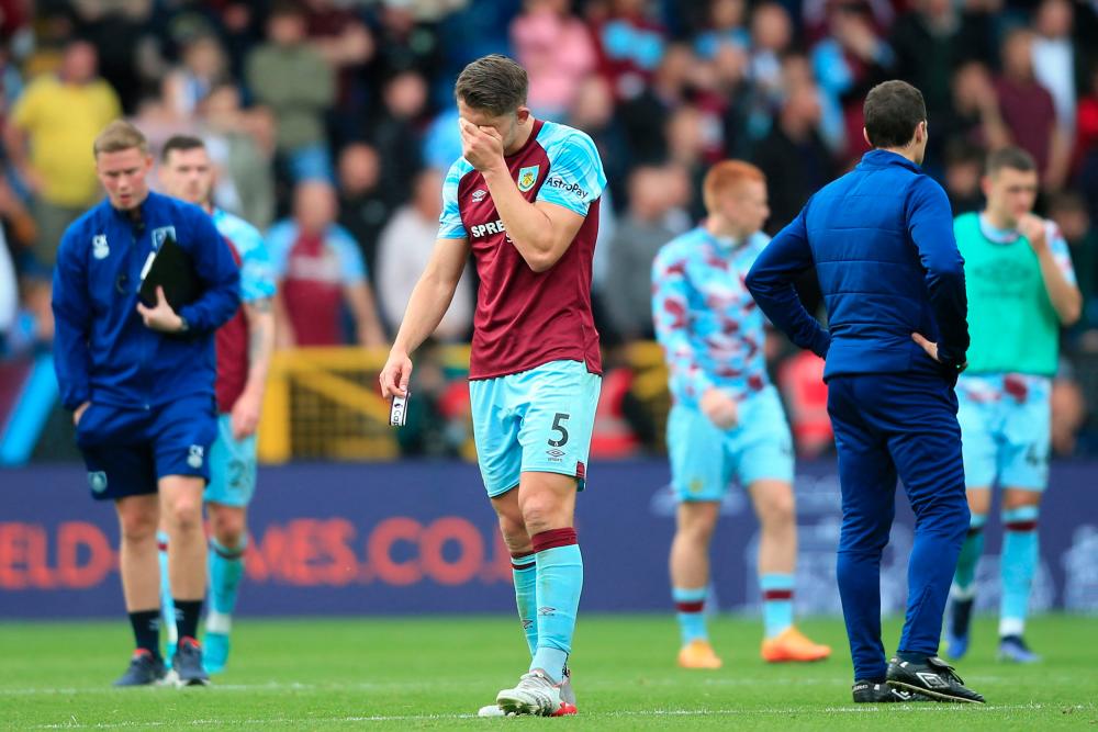 Burnley's English defender James Tarkowski reacts on the pitch after the English Premier League football match between Burnley and Newcastle United at Turf Moor in Burnley, north west England on May 22, 2022. AFPpix