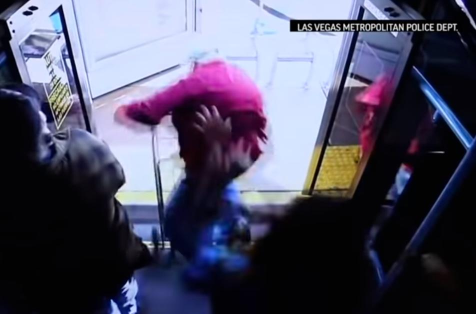 Screenshot of a footage showing the elderly man being shoved off the bus.