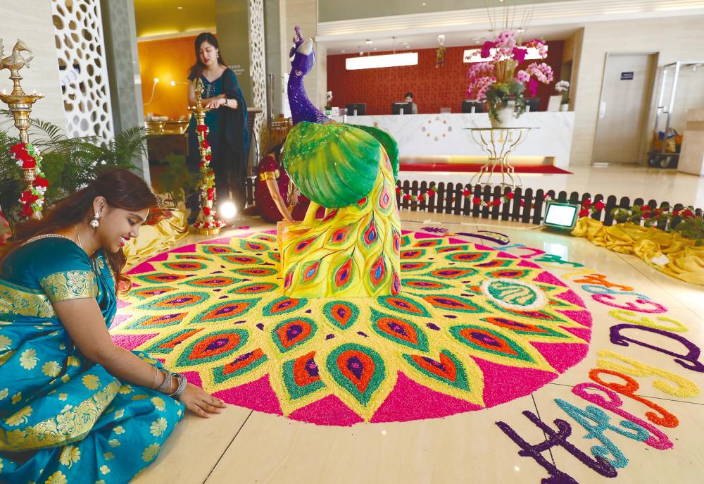 A kolam is meant to welcome Lakshmi, the Hindu Goddess of Prosperity, into one’s home. – Masry Che Ani/theSun