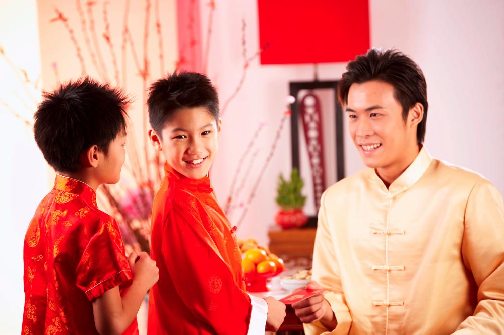$!Red envelopes also known as ang pow are given to children and unmarried adults.