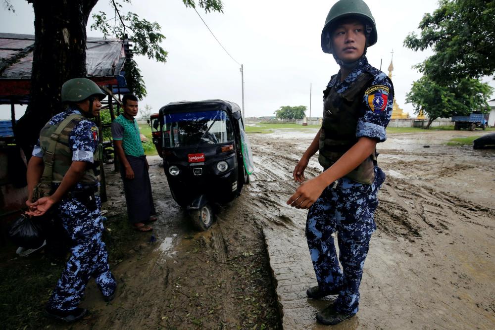 A Myanmar police officer stands guard in Maungdaw, Rakhine in July last year. — Reuters