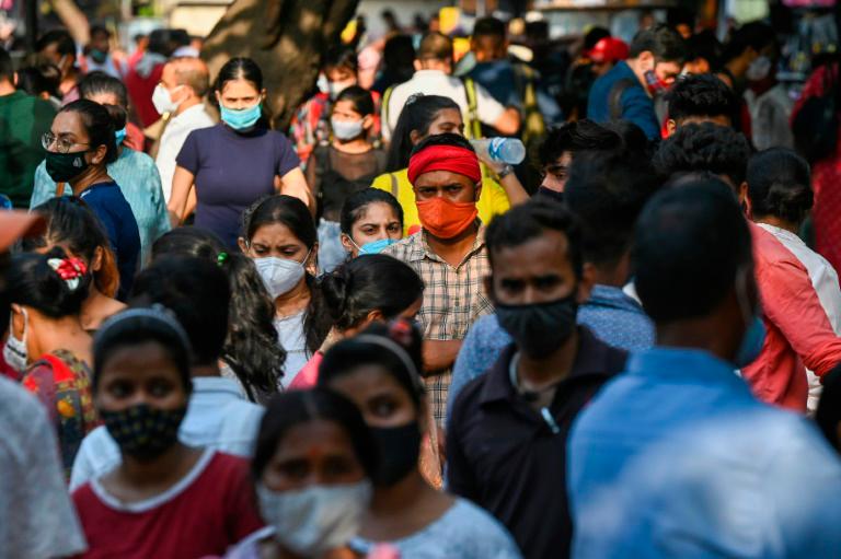 As a devastating coronavirus wave has eased, Indians have thronged markets and malls in many cities. — AFP