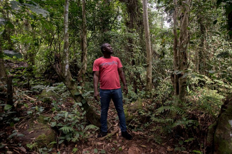 Environmentalists and activists like Daryl E. Bosu (C), fear how bauxite development will damage the Kyebi forest. Locals, though, are swayed by the prospects of jobs and money. — AFP