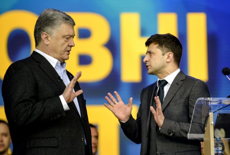 Ukrainian President Petro Poroshenko (L) and challenger Volodymyr Zelensky (R) are both hoping to win on Sunday. — AFP