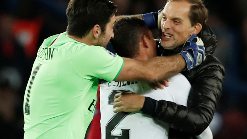 Paris St Germain’s Thiago Silva and Gianluigi Buffon celebrate with coach Thomas Tuchel at the end of the match. — Reuters