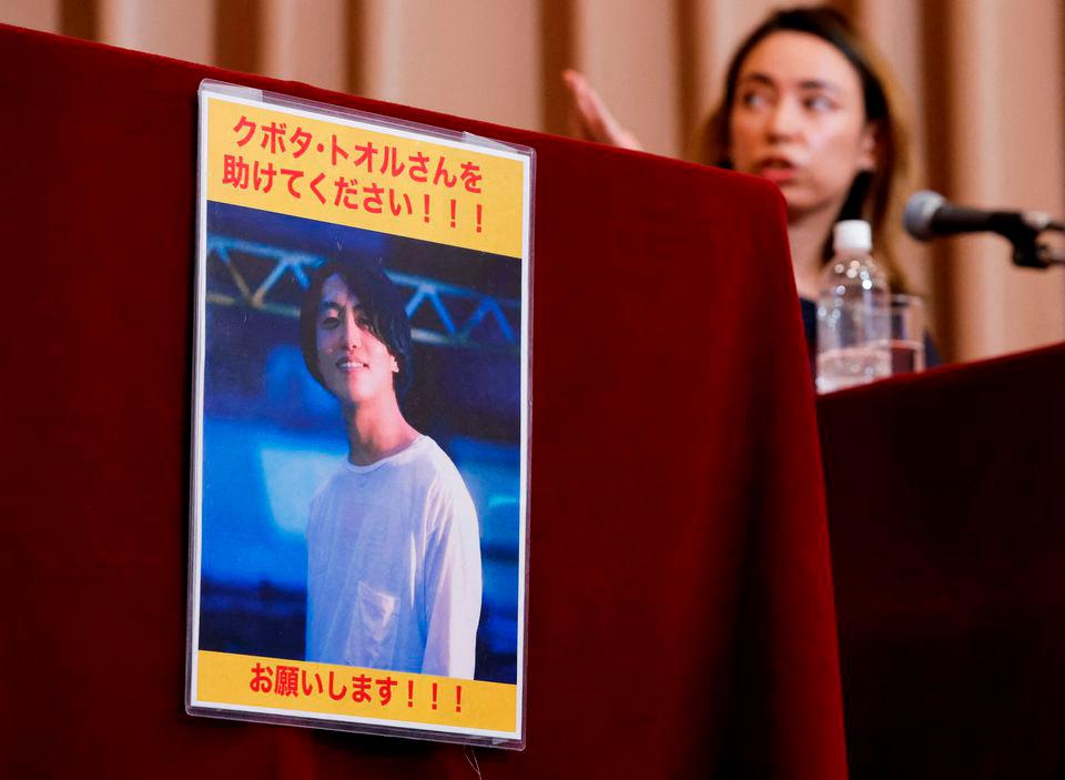 A portrait photo of Japanese documentary filmmaker Toru Kubota, who has been detained in Myanmar after filming a protest that took place on July 30, 2022, is displayed during a news conference by his friends including a radio personality Nikki Tsukamoto Kininmonth to call for his release at Japan National Press Club in Tokyo, Japan August 3, 2022. REUTERSPIX