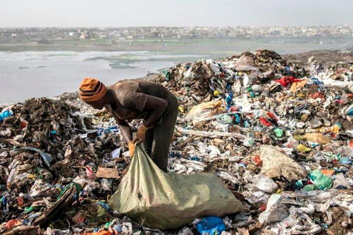 About 2,000 pickers ignore the stench and the fumes and make money by scavenging for plastic, iron and aluminium among the rubbish. — AFP