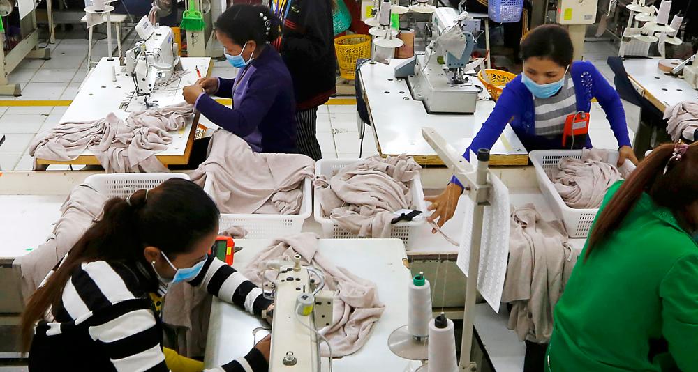 Workers in a Cambodian garment factory. About 60 million people work in Asia's garment industry. – REUTERSPIX