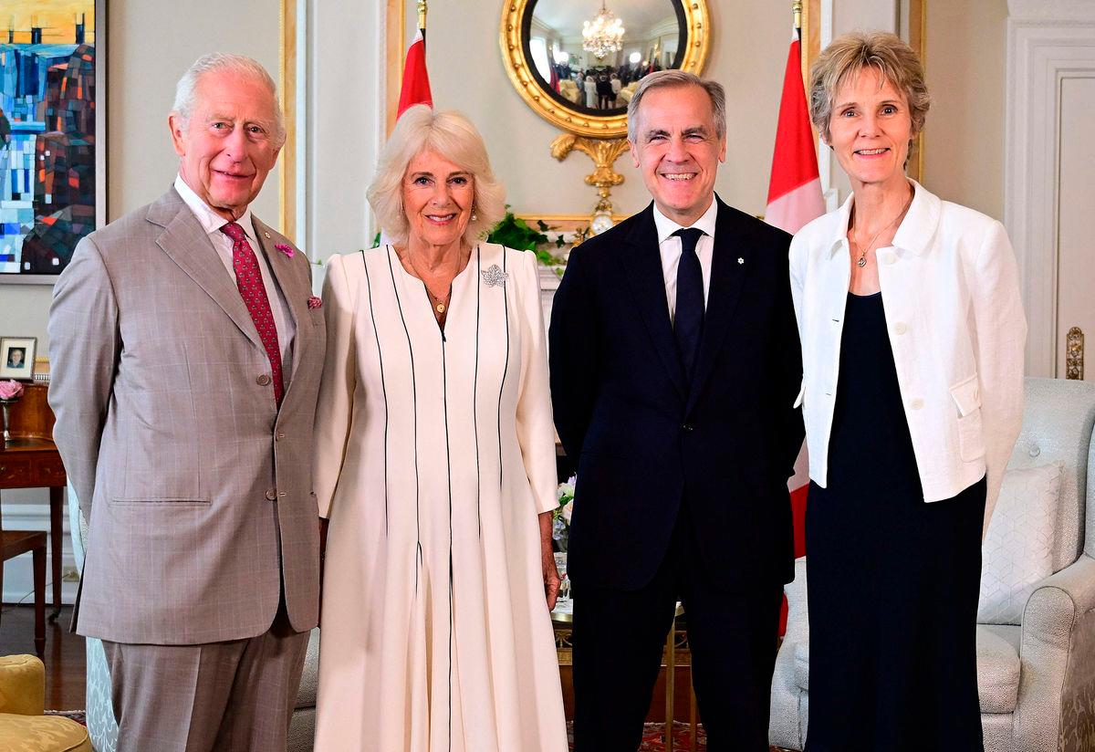 Britain’s King Charles III and Britain’s Queen Camilla pose fir a photograph with Canada’s Prime Minister Mark Carney and his wife Diana Fox Carney, during an audience at Rideau Hall, the official residence of the Governor General of Canada, in Ottawa, on May 26,
