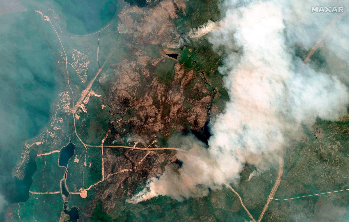 This handout satellite picture courtesy of Maxar Technologies shows an overview of fires at Little Bear Lake, Saskatchewan, Canada on May 30, 2025. AFP PHOTO / HANDOUT / MAXAR TECHNOLOGIES