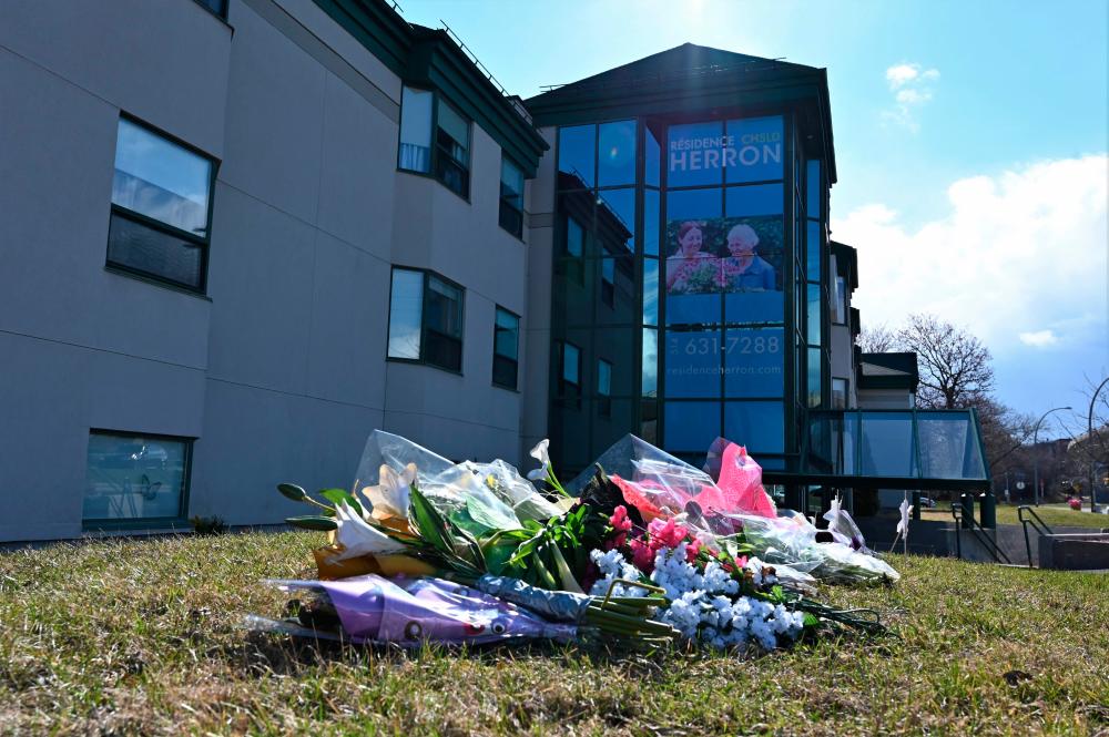 This photo taken on April 16, 2020 shows flowers outside the Herron private nursing home in Dorval, west of Montreal. — AFP