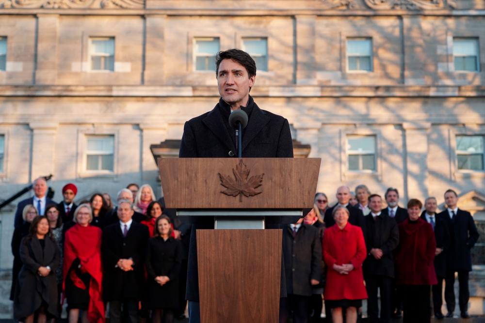 Canadian Prime Minister Justin Trudeau speaks after swearing-in his new cabinet during ceremony at Rideau Hall on Nov 20, in Ottawa, Canada. — AFP