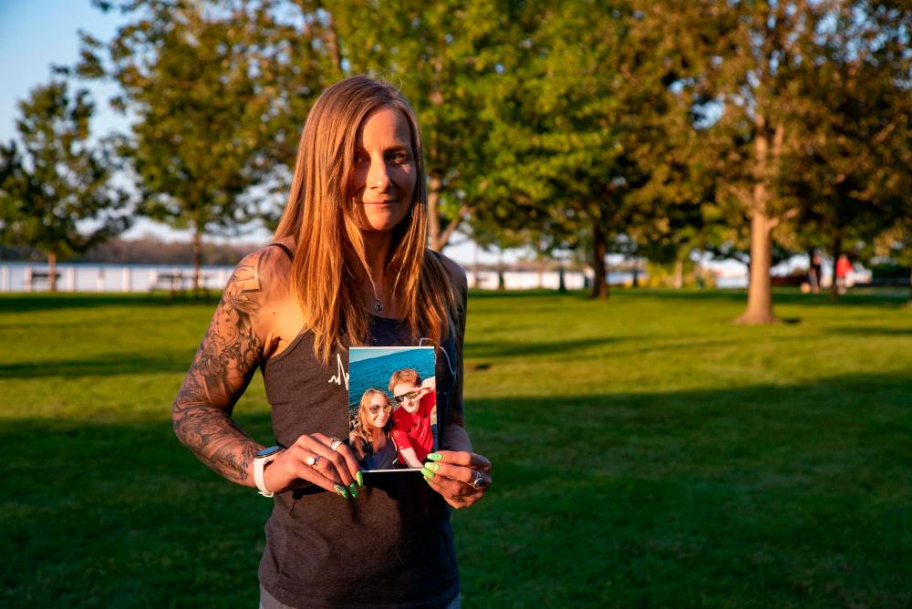 Kim Prosser poses for a portrait while holding a photo of her son Ashtyn Prosser, in Windsor, Ontario, Canada, on September 14, 2023. AFPPIX