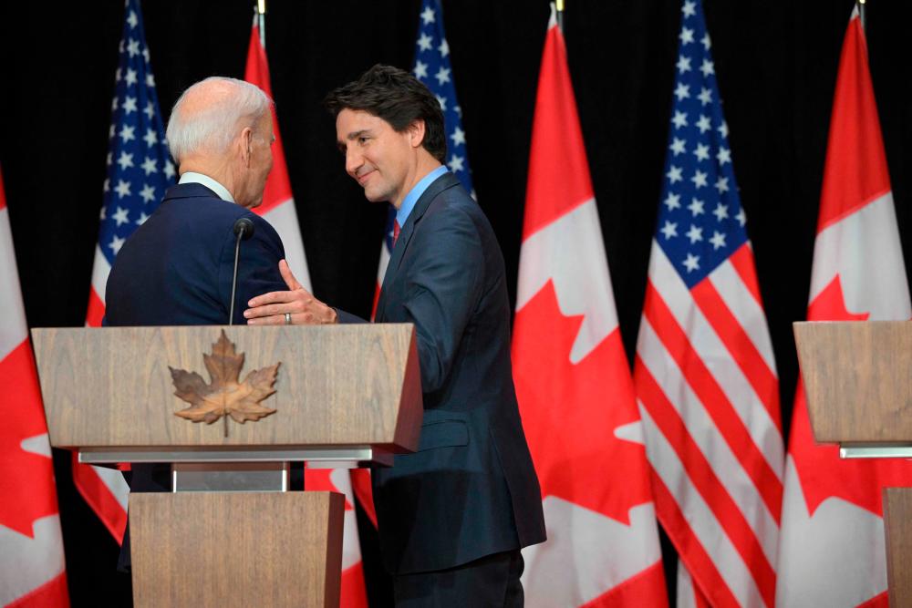 Canada’s Prime Minister Justin Trudeau and US President Joe Biden take part in a joint press conference in the Sir John A. Macdonald Building in Ottawa on March 24, 2023. AFPPIX