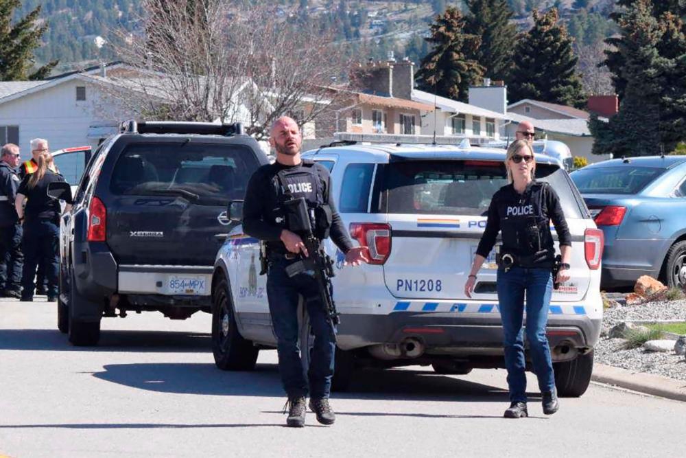 Royal Canadian Mounted Police (RCMP) officers attend a shooting scene on Cornwall Drive, during a series of attacks in which four people were shot dead, in Penticton, British Columbia, Canada April 15, 2019. — Reuters