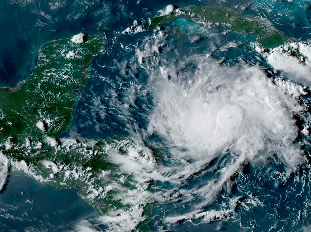 This NOAA/GOES satellite image shows Tropical Storm Nana (R) in the Caribbean at 22:00UTC, on September 1, 2020. — AFP