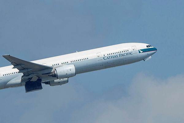 Picture shows a Cathay Pacific passenger jet taking off from Hong Kong International Airport.
