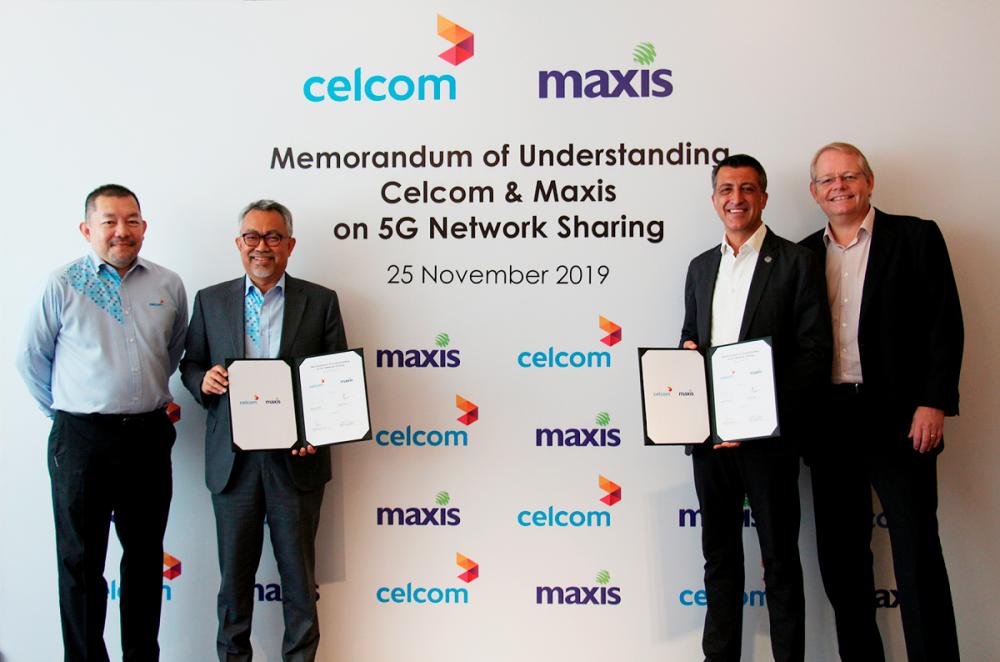 From left: Celcom Axiata Bhd chief strategy and value creation officer Muniff Kamaruddin, CEO Idham Nawawi, Maxis Bhd CEO Gokhan Ogut, and chief technology and information officer Morten Bangsgaard at the signing today.