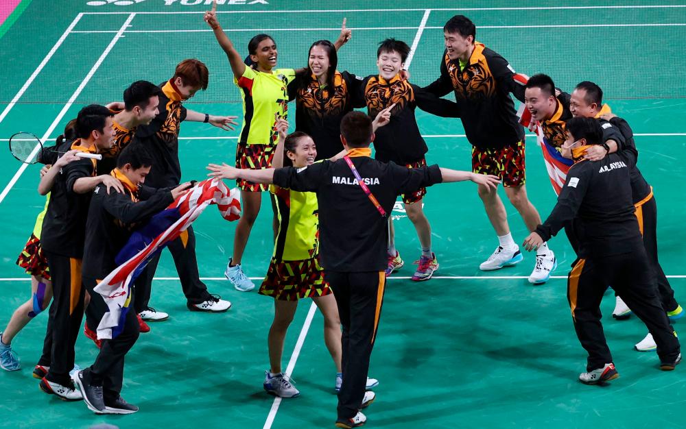 The Malaysia team celebrate beating India in the Mixed Team Gold Medal badminton match on day five of the Commonwealth Games at the NEC Arena in Birmingham, central England, on August 2, 2022. AFPPIX