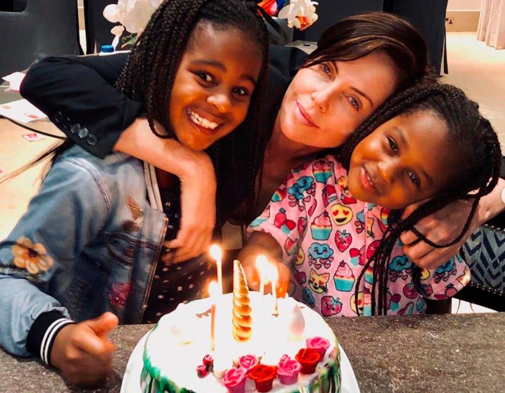 $!Theron has been getting tips about raising her daughters to honour their Black heritage. – Charlize Theron Instagram