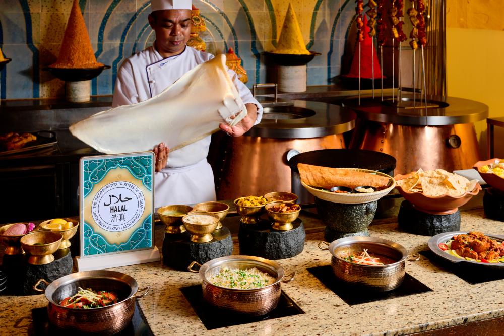 A chef making Indian bread.