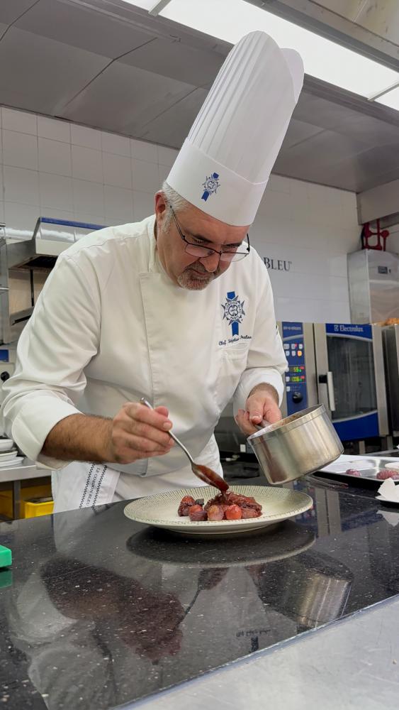 $!Frelon putting finishing touches on a dish at the Plant-based Treasures for Charity event.