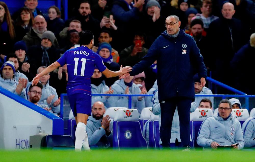 Chelsea’s Pedro shakes hands with manager Maurizio Sarri after being substituted off — Reuters