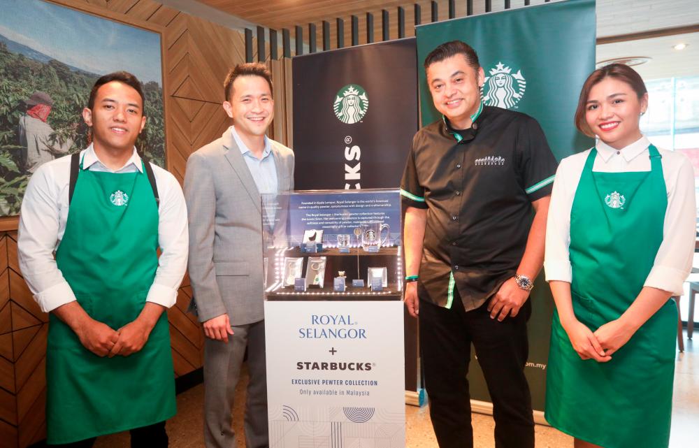 Chen (second from left) and Quays unveiling the Starbucks X Royal Selangor collection.