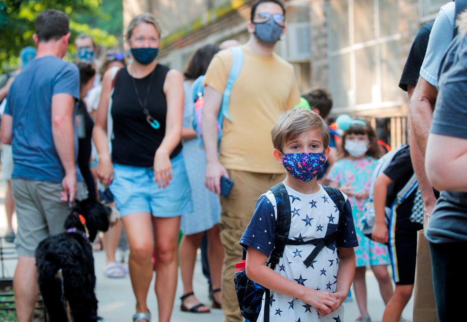 A child wears a face mask on the first day of New York City schools, amid the coronavirus disease (Covid-19) pandemic in Brooklyn, New York, U.S. September 13, 2021. REUTERSpix