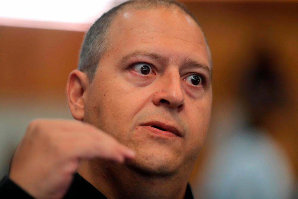 Sebastian Marroquin, son of the late Colombian drug lord Pablo Escobar, speaks during a conference in Santiago on January 12, 2023/AFPPix