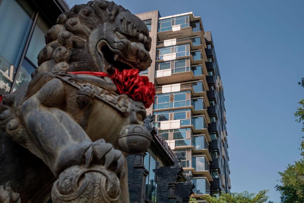 A general view shows a luxury apartment building, where two flats in which Hong Kong-born actor Jackie Chan and his family had lived, in Beijing on September 1, 2020. Two luxury Beijing apartments where Hong Kong-born martial arts star Jackie Chan and his family have lived are to be put up for auction for over 10 million USD due to an ownership dispute, court documents show. / AFP / NICOLAS ASFOURI