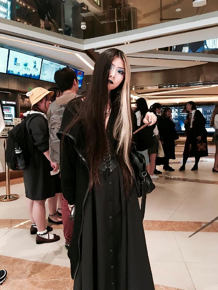 This handout picture released by Laore Gein on March 19, 2019 and taken on Nov 15, 2018 shows Laore Gein standing in a movie theatre in Guangzhou in China's southern Guangdong province. — AFP