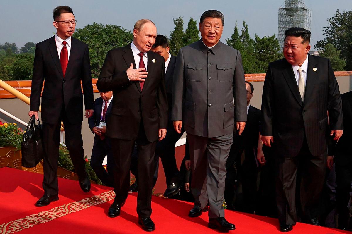 In this pool photograph distributed by the Russian state agency Sputnik, (2nd L-R) Russia’s President Vladimir Putin walks with China’s President Xi Jinping and North Korea’s leader Kim Jong Un before a military parade marking the 80th anniversary of victory over Japan and the end of World War II, in Beijing’s Tiananmen Square on September 3, 2025. (Photo by Alexander KAZAKOV / POOL / AFP)